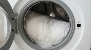 Close-up of a fully washable pillow in a washing machine