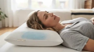 Side sleeper using an ergonomic gel memory foam pillow for proper spinal alignment and neck pain relief.