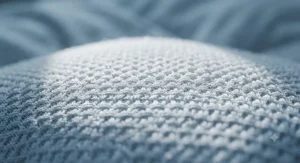 Close-up of a breathable, moisture-wicking cooling pillow protector fabric ideal for Canadians dealing with night sweats.