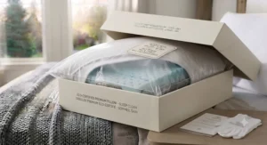 Customer unboxing a brand new pillow that doesn't smell, ready for immediate use without any chemical or factory off-gassing odors in a Canadian home.